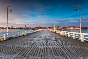Cold morning, Pier in Sopot at sunrise with amazing colorful sky. Winter in Poland.