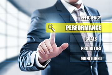 Performance Efficiency Impoverment concept on presentation screen. Man pressing button on display with word in modern office
