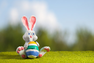 White Rabbit from polymer clay on the lawn with painted egg char