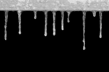 Obraz na płótnie Canvas frozen the icicles, drops, isolated on a black background