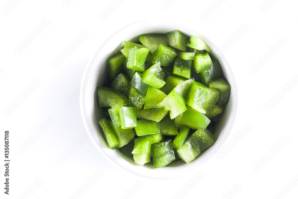 Wall mural diced green pepper in white bowl