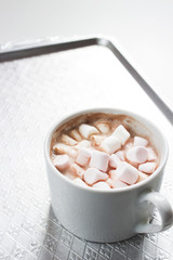 Obraz na płótnie Canvas Mug filled with hot chocolate and marshmallow