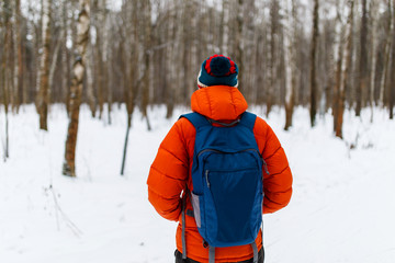 Fototapeta na wymiar Guy with backpack in winter