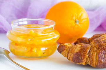 Fototapeta na wymiar Closeup on jar with orange jam 
