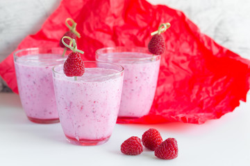 Fresh berry smoothie set of three glasses with blackberry and raspberry for healthy breakfast on white background