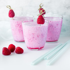 Fresh berry smoothie set of three glasses with blackberry and raspberry for healthy breakfast on white background