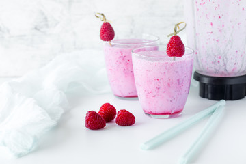 Fresh berry smoothie set of three glasses with blackberry and raspberry for healthy breakfast on white background