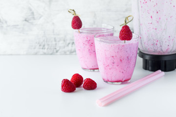 Fresh berry smoothie set of three glasses with blackberry and raspberry for healthy breakfast on white background