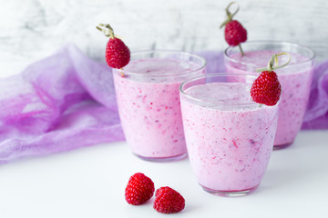 Fresh berry smoothie set of three glasses with blackberry and raspberry for healthy breakfast on white background
