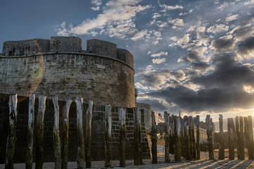 Tower and breakwater on sandy beach in Saint-Malo, France