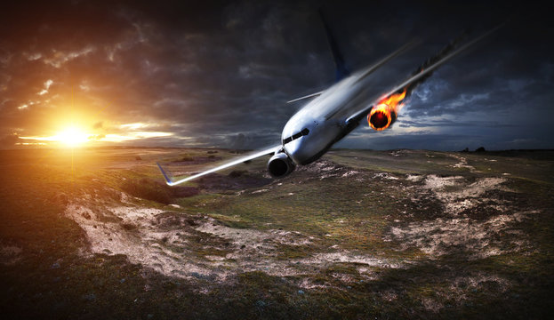 Airplane crashing down with engine on fire