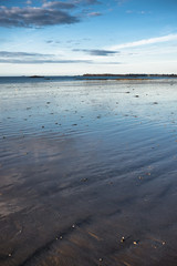 Endless sand shore of Atlantic ocean at low-tide in Saint-Malo, France