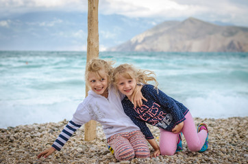 Fototapeta na wymiar smiling children having fun in the beach