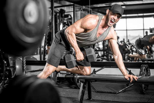 One-arm Dumbbell Rows In Gym