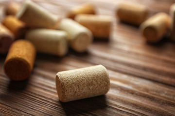 Fototapeta na wymiar Wine corks on wooden background