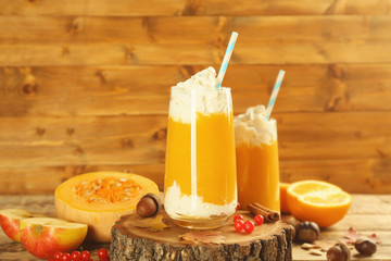 Two glasses of pumpkin smoothies on table