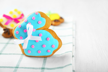 Creative rabbit shape Easter cookie on napkin, closeup