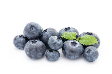 Close up of a blueberry branch isolated over white.
