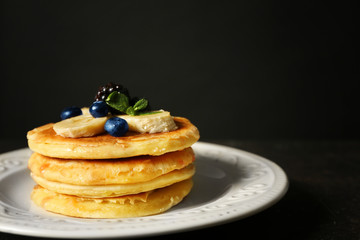 Stack of fresh pancakes with blueberry on plate
