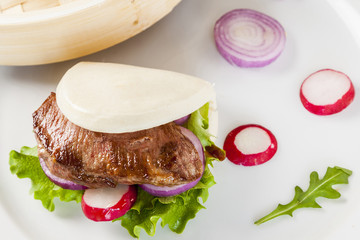 Gua bao, steamed sandwich, grilled pork bun with vegetables,pres