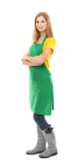 Beautiful woman in green apron isolated on white background