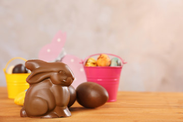 Chocolate Easter rabbit and sweets on  wooden table