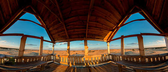 Wooden lookout alcove overlooking the sandy desert