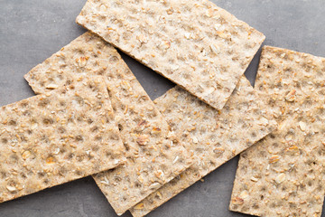 Stack of wholegrain crispy bread with sunflower, chia and sesame