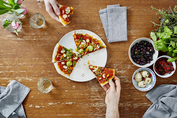social gathering eating and sharing organic pizza