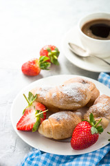 Mini croissants with berries and coffee.