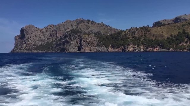 Boat leaving island of Majorca in Spain