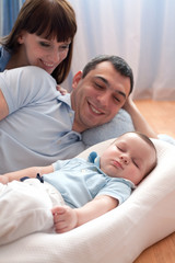 Obraz premium young family with newborn