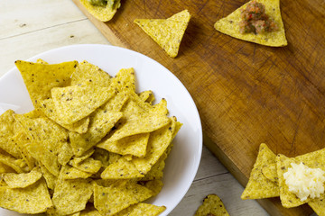Tortilla chips with guacamole and salsa dips