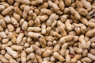Peanuts  background.  Raw peanuts.  Many peanuts in shells