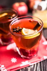Tea with lemon and honey on wooden background