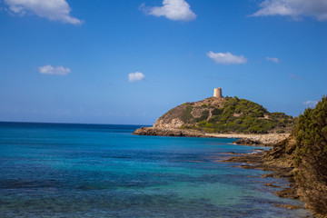 Fototapeta premium Italy Sardinia Torre di Chia bay with blue sky