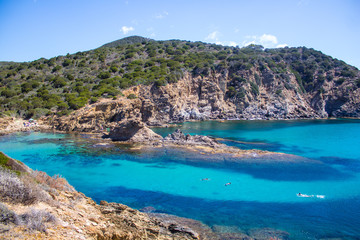 Sardinia beatifull creek crystal water with rock and tree