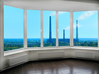 wide window with view to the landscape with nature and pollution of environment