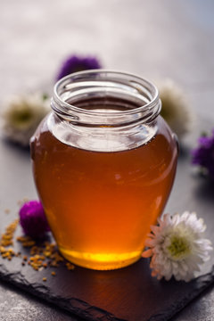 Sweet fresh honey in the glass jar.