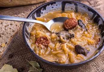 Slovak christmas cabbage soup with mushrooms on natural background.