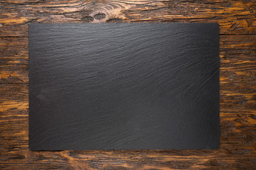 slate board on wooden background