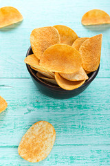 potato chips in a clay plate