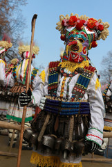 PERNIK, BULGARIA - JANUARY 29, 2017 - Masquerade festival Surva in Pernik, Bulgaria. People with mask called Kukeri dance and perform to scare the evil spirits