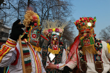 Fototapeta premium PERNIK, BULGARIA - JANUARY 29, 2017 - Masquerade festival Surva in Pernik, Bulgaria. People with mask called Kukeri dance and perform to scare the evil spirits