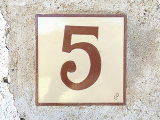 Ceramic tile with numer five 5