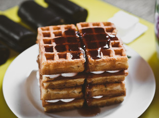 Waffle biscuits with jam close up on plate close up. Morning breakfast.