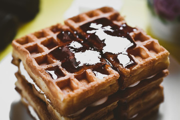 dessert with soft waffle, tea and raspberry jam