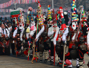 PERNIK, BULGARIA - JANUARY 29, 2017 - Masquerade festival Surva in Pernik, Bulgaria. People with mask called Kukeri dance and perform to scare the evil spirits