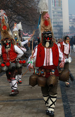 Fototapeta premium PERNIK, BULGARIA - JANUARY 29, 2017 - Masquerade festival Surva in Pernik, Bulgaria. People with mask called Kukeri dance and perform to scare the evil spirits
