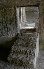 Fototapeta na wymiar The underground floor in the medieval cave city Chufut-Kale near Bakhchisarai, Crimea
